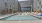 Large sparkling blue pool with a large pool deck and lounge chairs