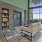 Large lounge with wood floors and a fireplace