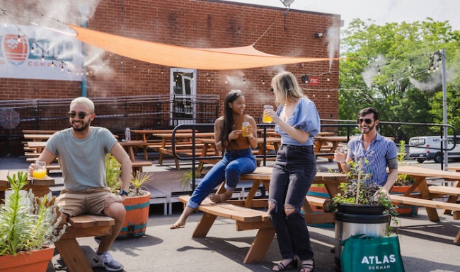 Group of people outside enjoying drinks 